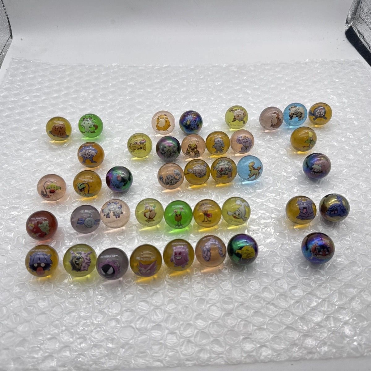 สินค้าลิขสิทธิ์แท้ของโปเกมอน,  - Vintage Collectible Marbles บทวิจารณ์และราคา